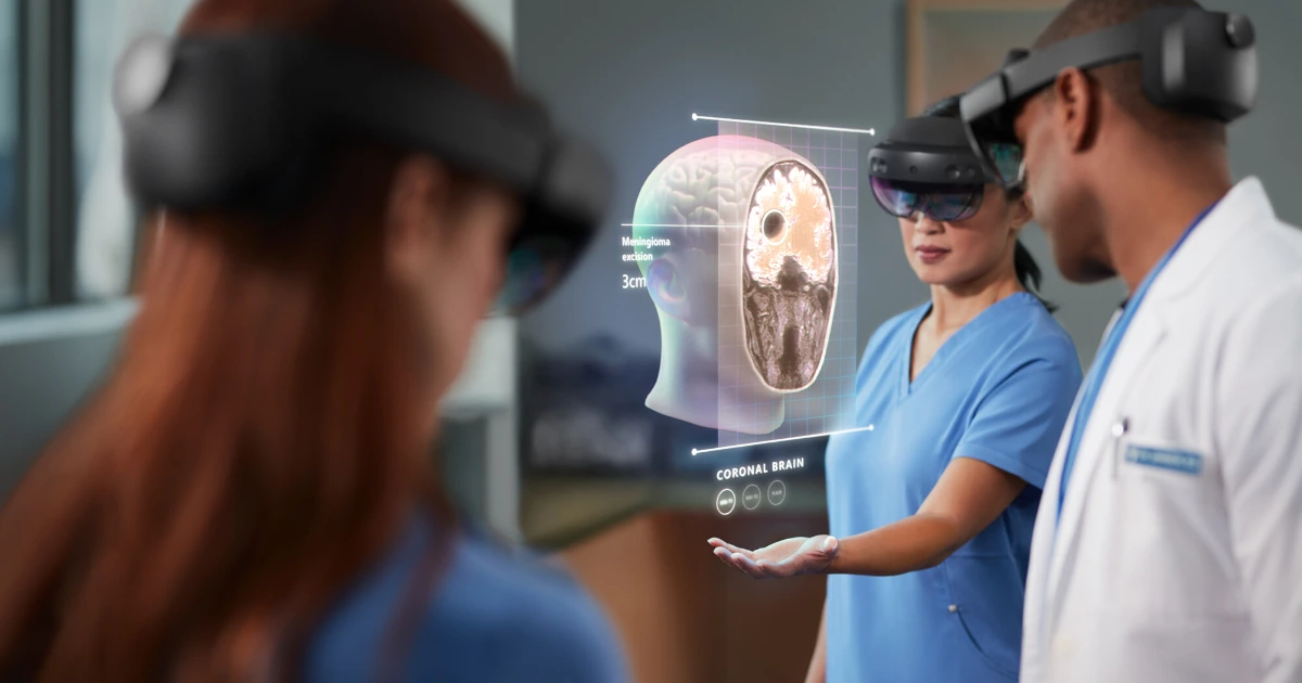 Three HoloLens-wearing doctors are looking at a coronal brain hologram.