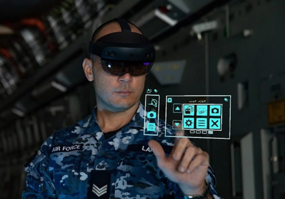 An Air Force officer navigating a hologram.